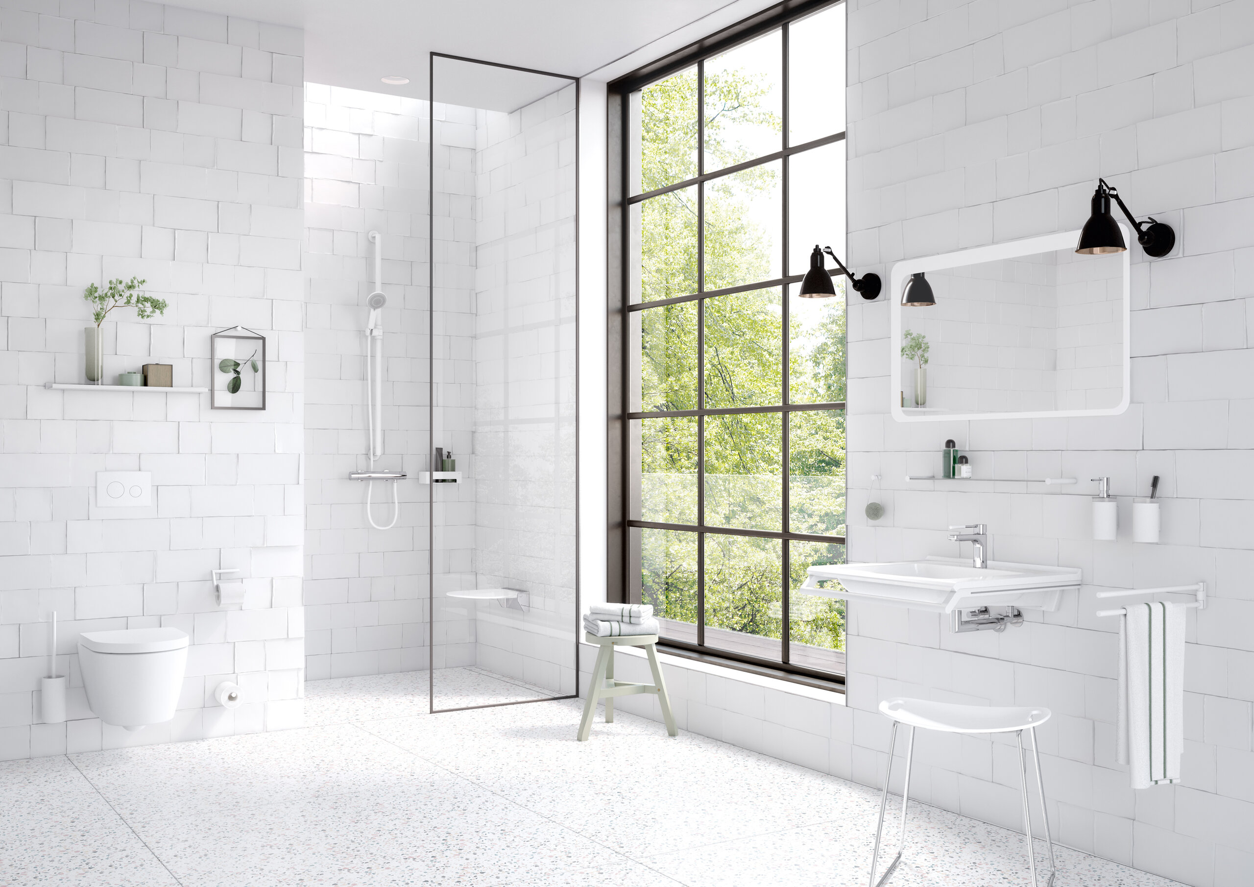 Salle de bain, équipée d'accessoires sanitaires tels que porte-serviettes, distributeur de savon, porte-papier toilette en blanc mat